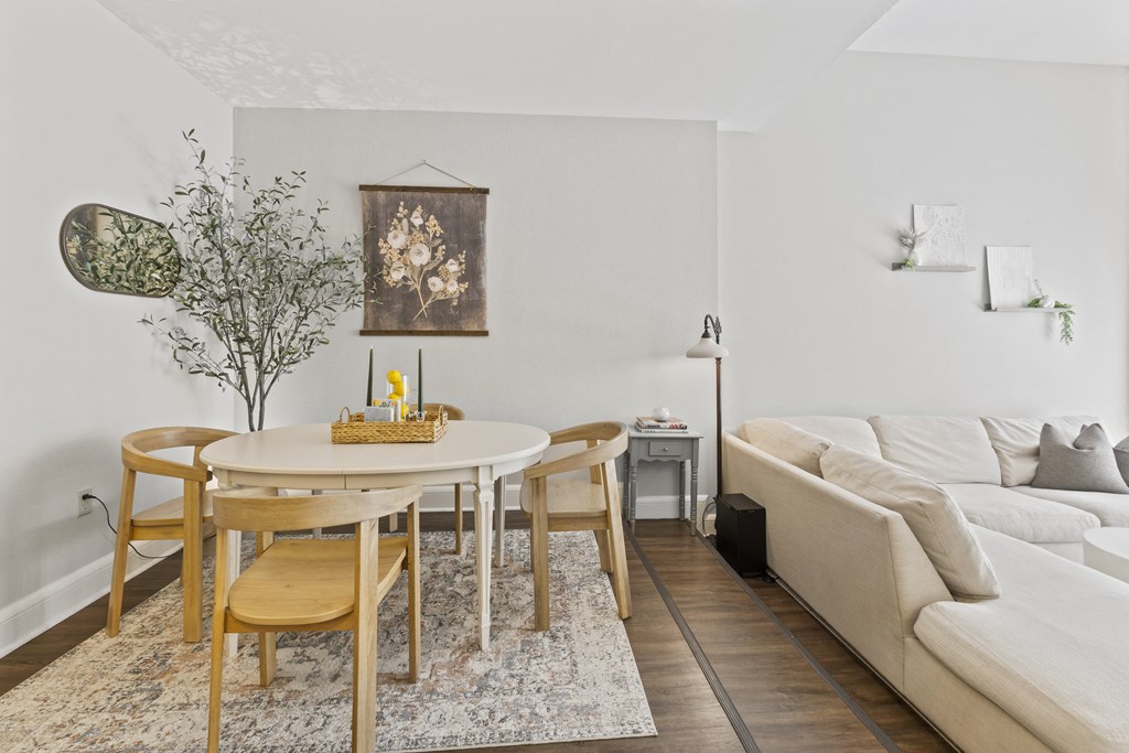 a living room with a round table and a couch