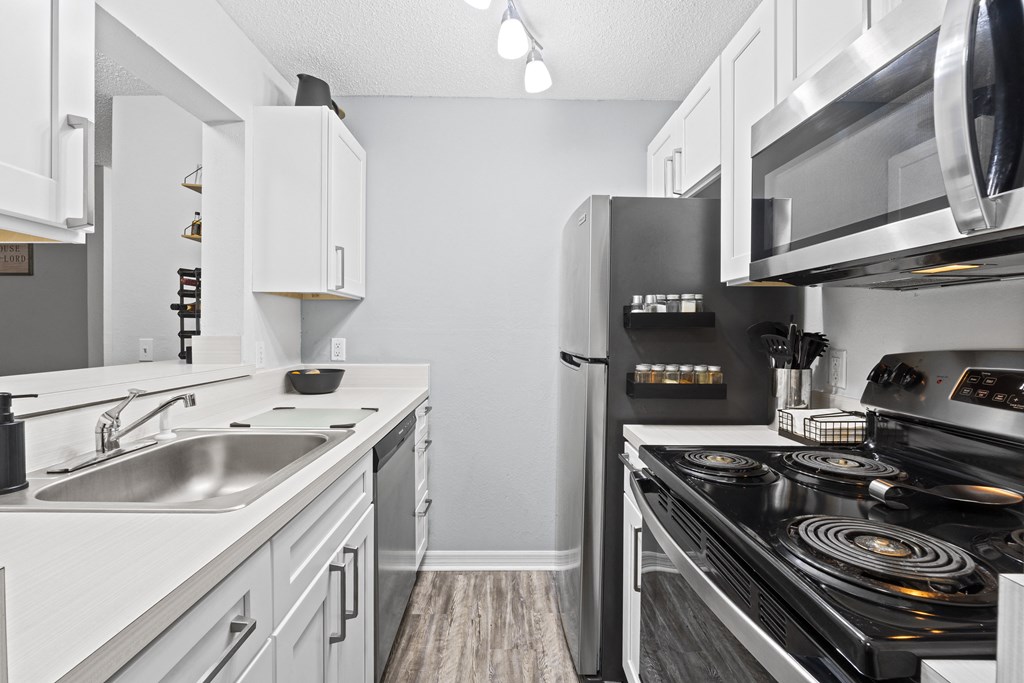 the preserve at ballantyne commons apartment kitchen with stainless steel appliances