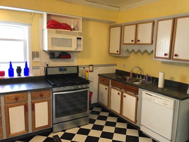 a kitchen with a black and white checkered floor
