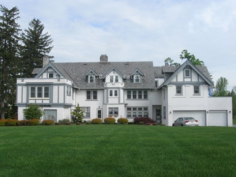 A large house with a sign that says Estate on the front.