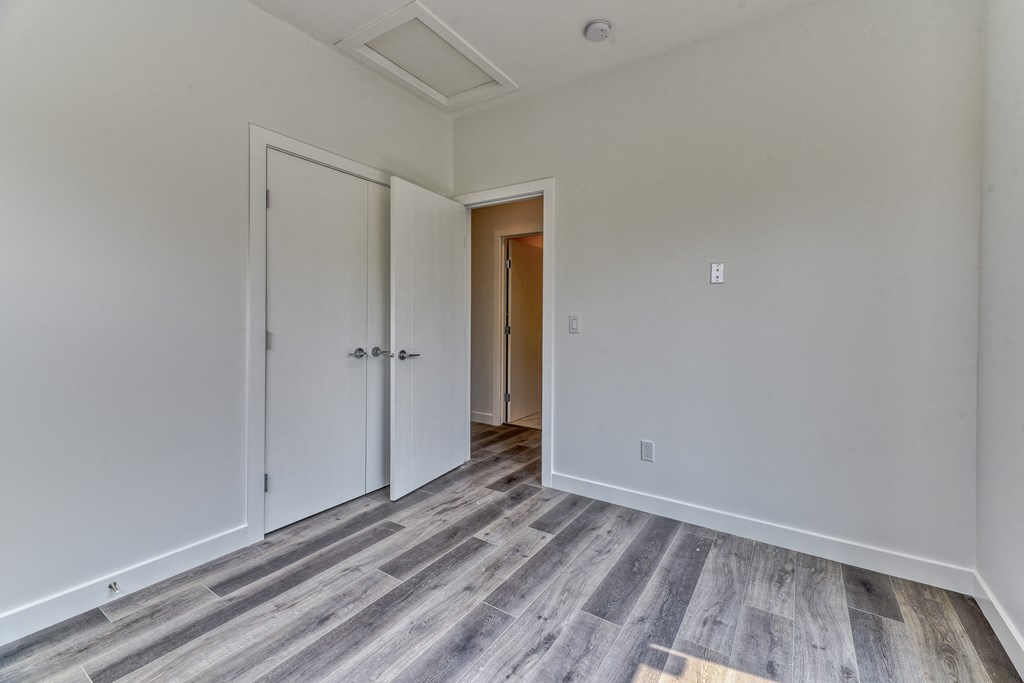 A room with a grey floor and white walls.