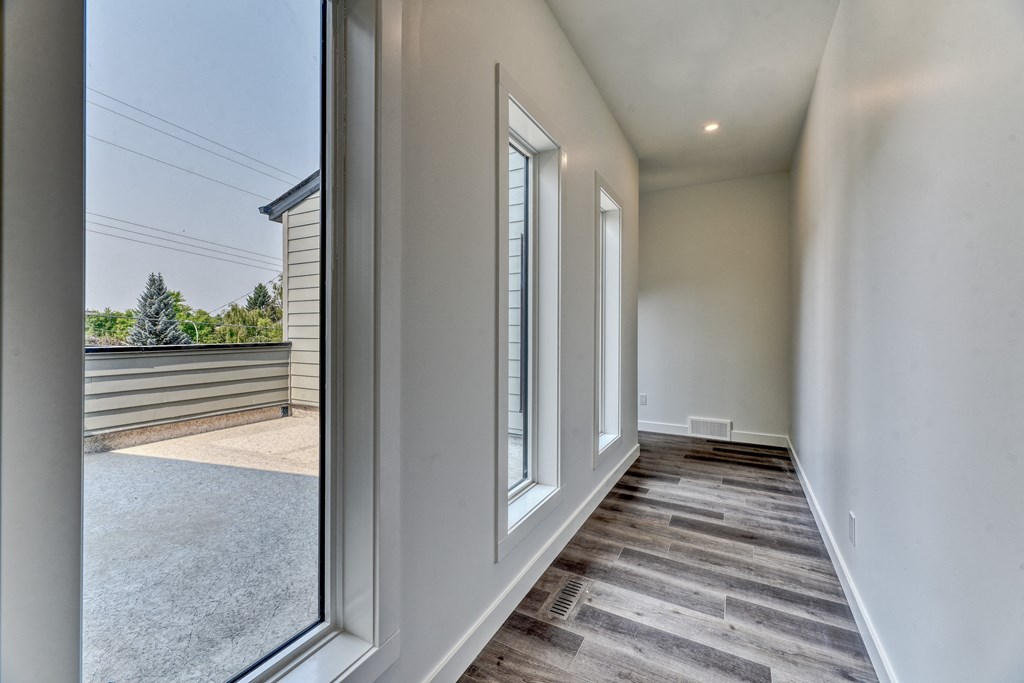 A long hallway with a window on the left side.