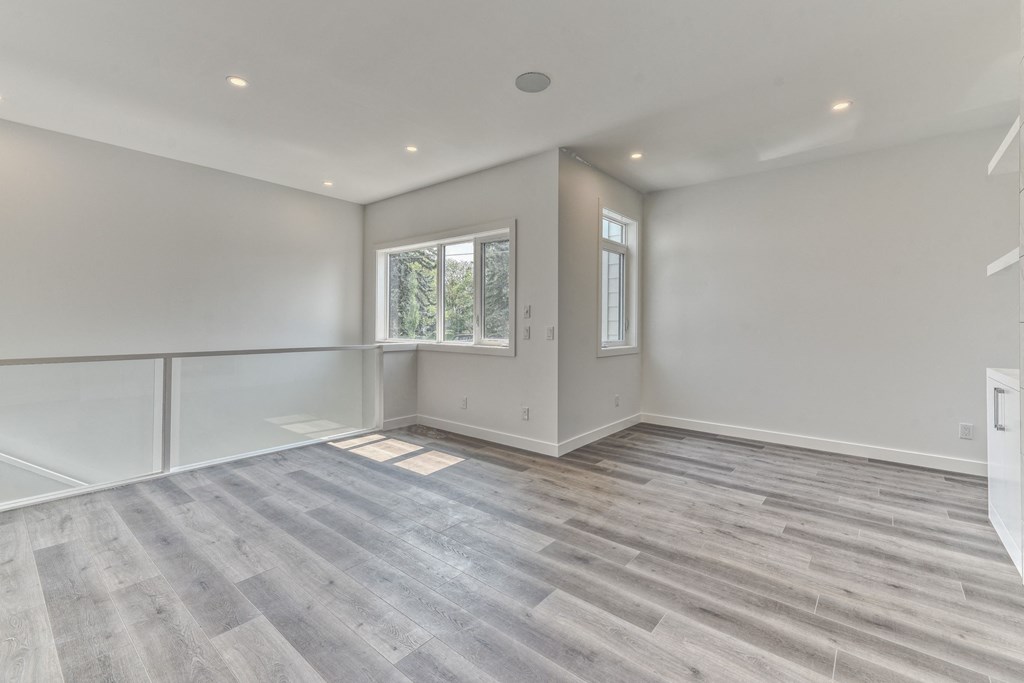 A room with a grey floor and white walls.