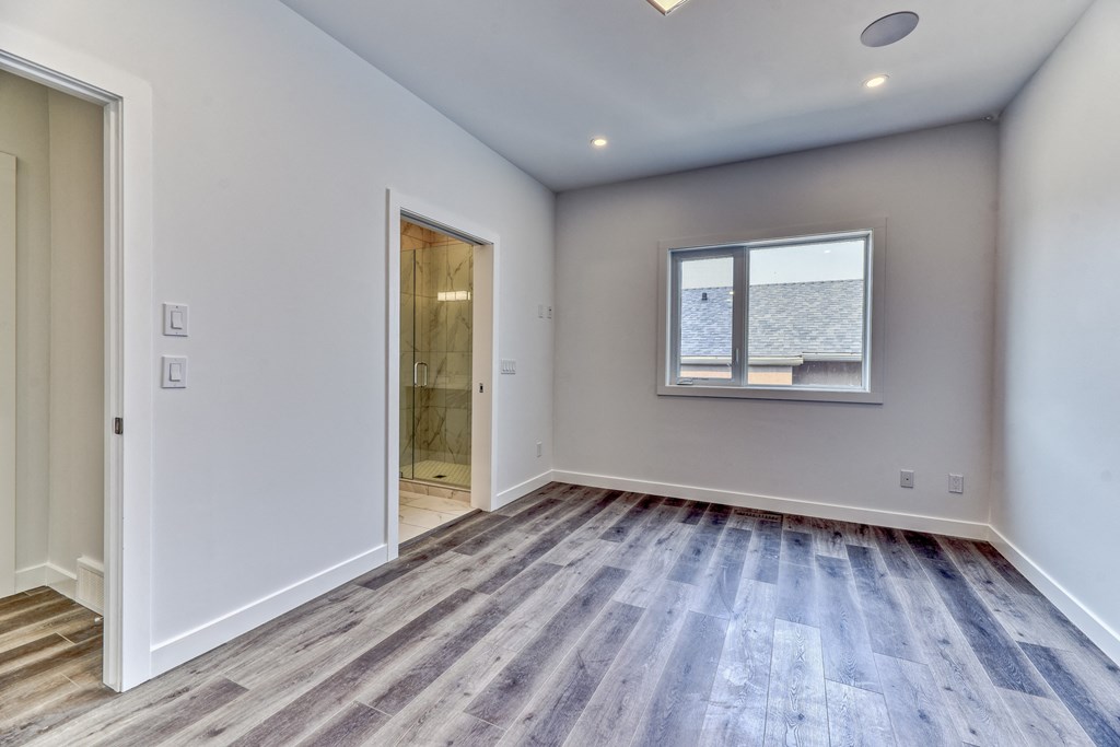 A room with a window and a door.