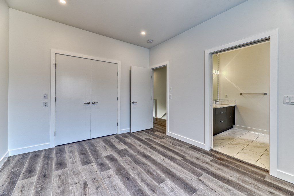 A room with a grey floor and white walls.