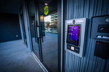 a condom dispensing machine outside of a building