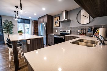 a kitchen with a large island and a sink