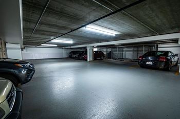 a parking garage with cars parked in it