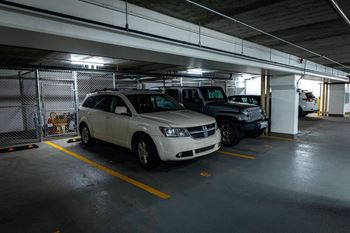a parking garage with cars parked in it