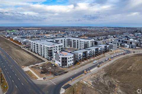 A road with a white car driving on it.