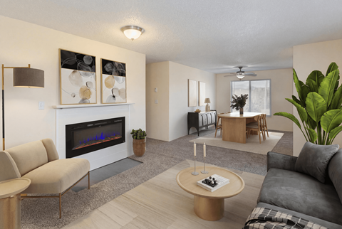 A modern living room with a fireplace and a dining area.