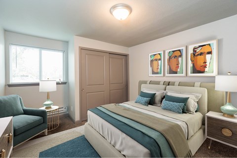 A bedroom with a bed, a chair, and a painting on the wall.