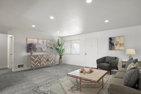 A living room with a couch, armchair, and coffee table.