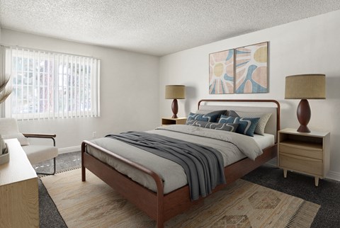 A bedroom with a bed, nightstand, and chair.