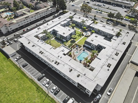 A large building with a pool in the middle of it.