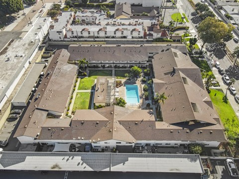 A large building with a pool in the middle of it.