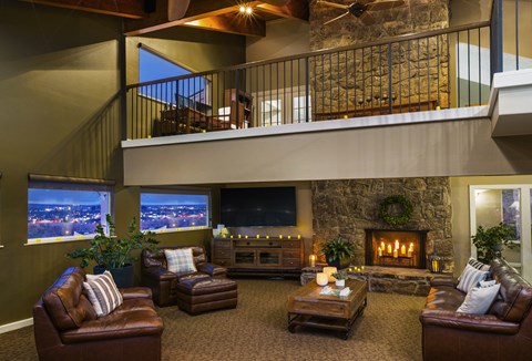 A cozy living room with a fireplace and comfortable seating.