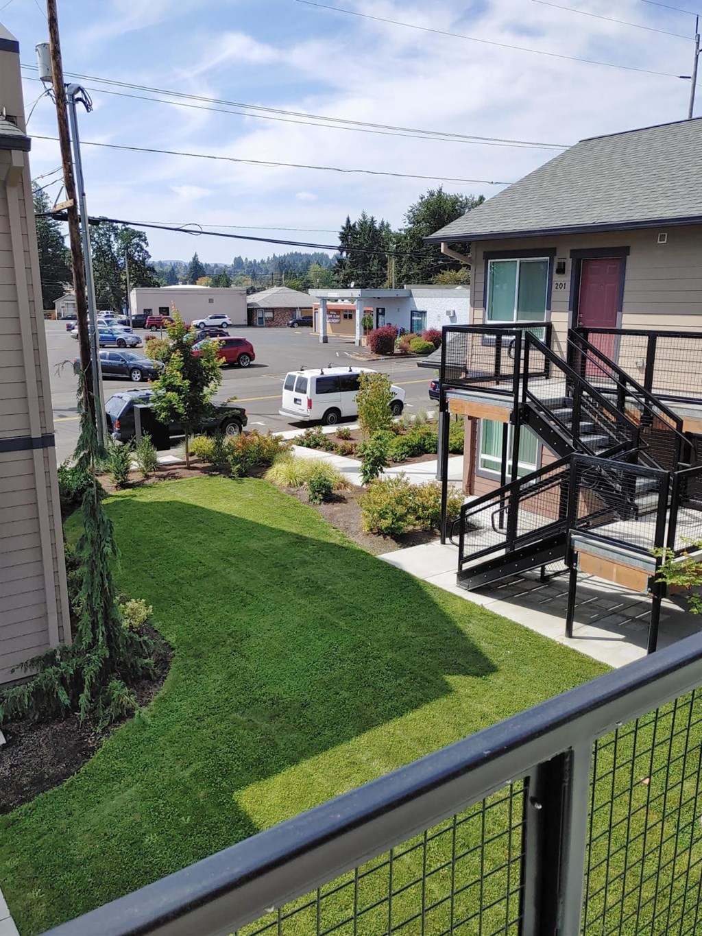 a view of the yard from the balcony of a house