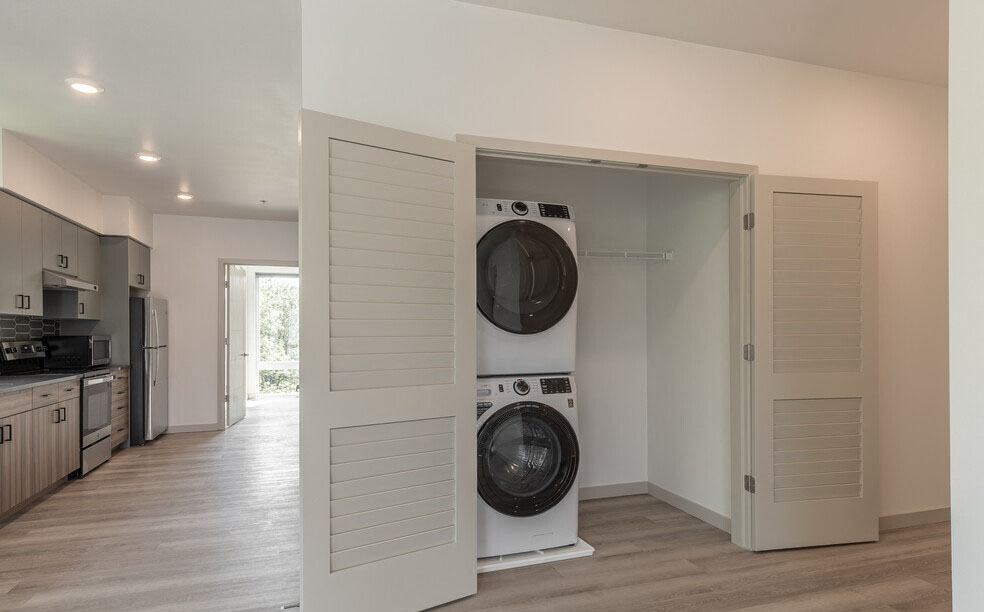 a washer and dryer in a room with a kitchen