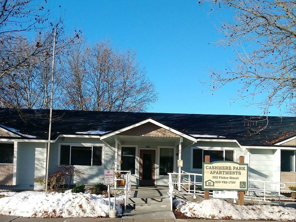 a white building with a sign in front of it