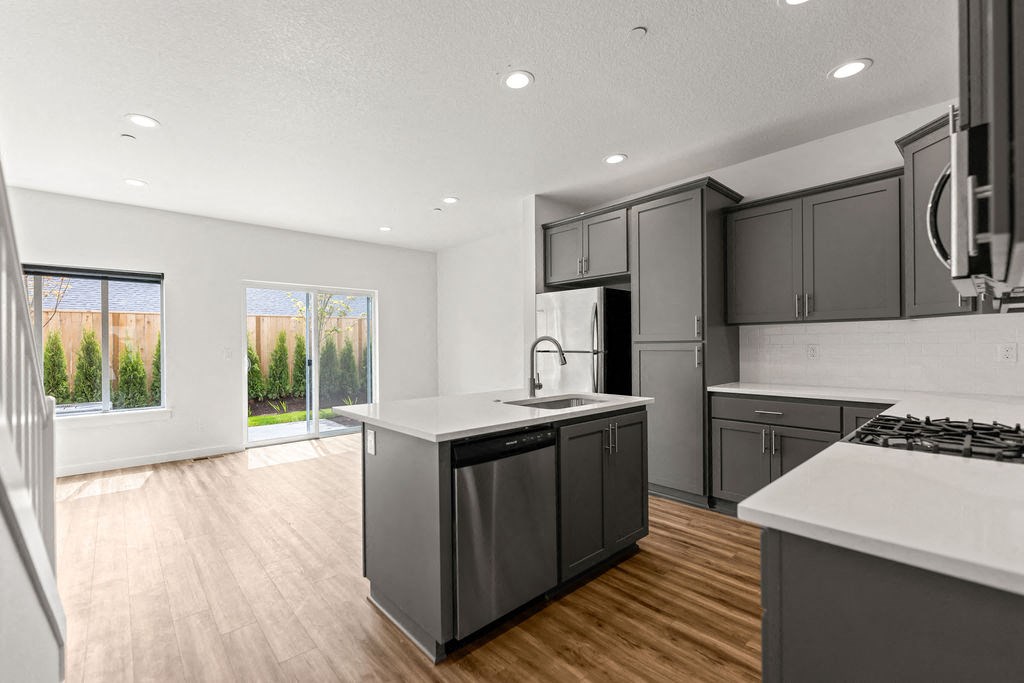 a kitchen with a large island in the middle of it