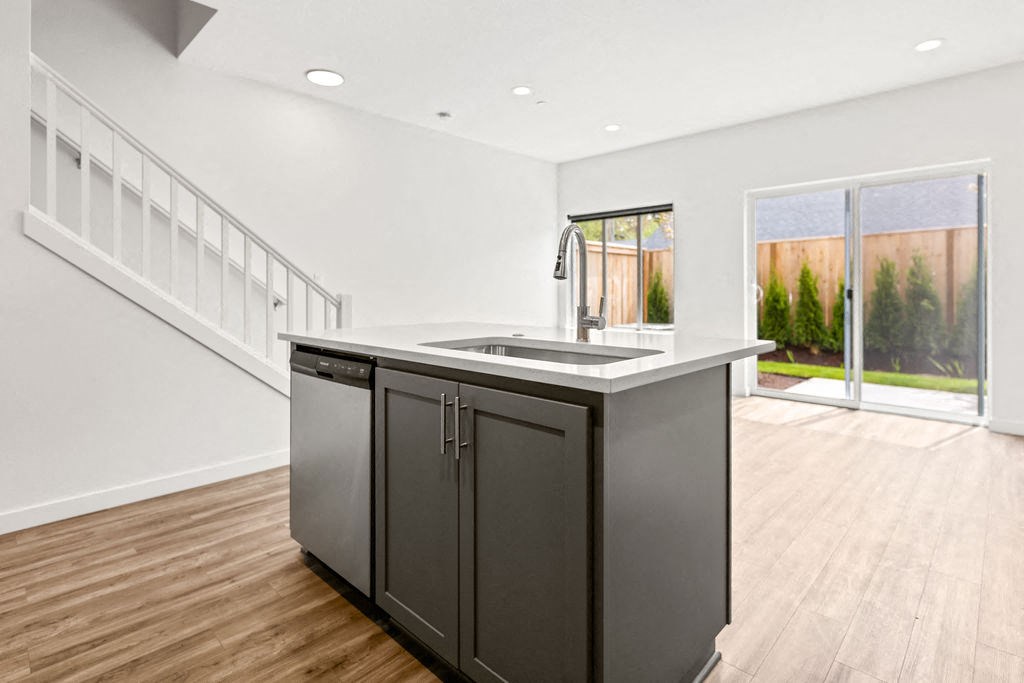 a kitchen with a large island in the middle of a room