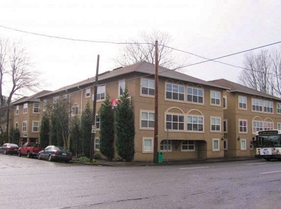 the corner of a street and two buildings