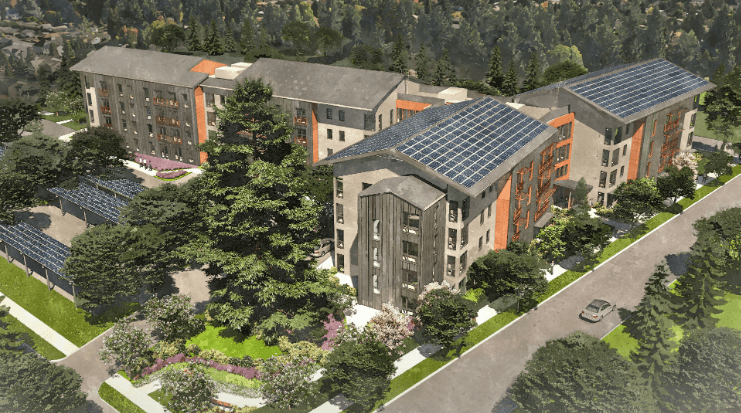 an aerial view of an apartment building with solar panels on the roof