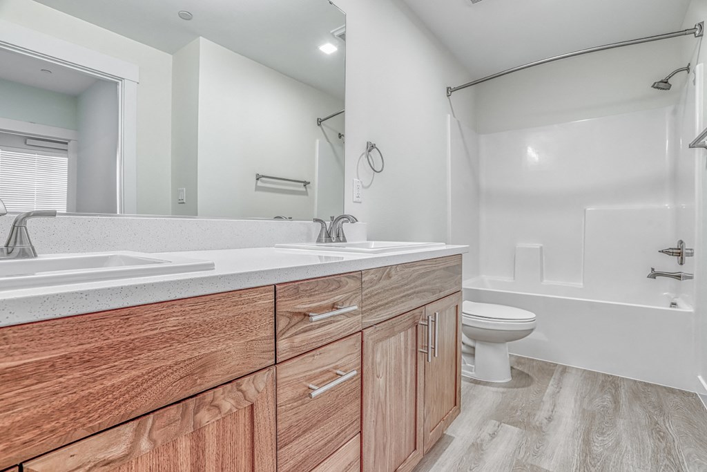 a bathroom with a toilet sink and bathtub