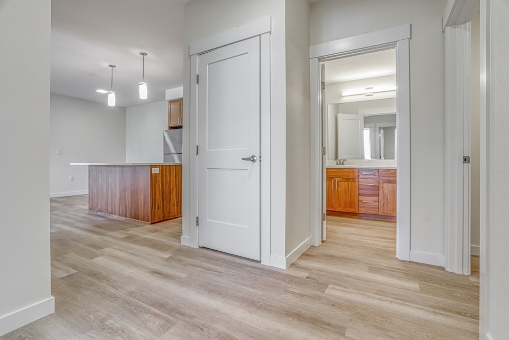 a bedroom with a medium sized bed and a desk with a chair in a room with a