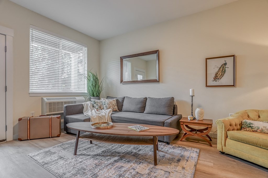 a living room with a couch and a chair