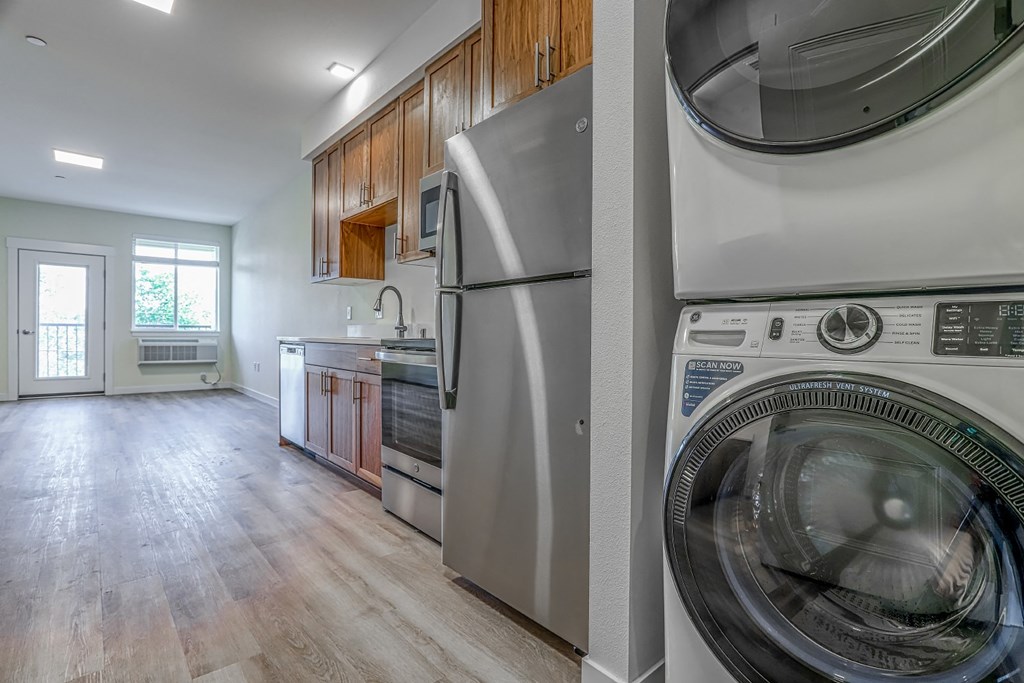 a kitchen and laundry room with a washer and dryer