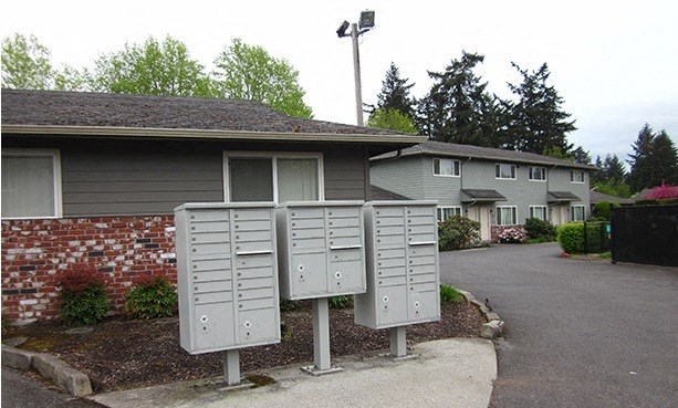 a house with several mailboxes in front of it