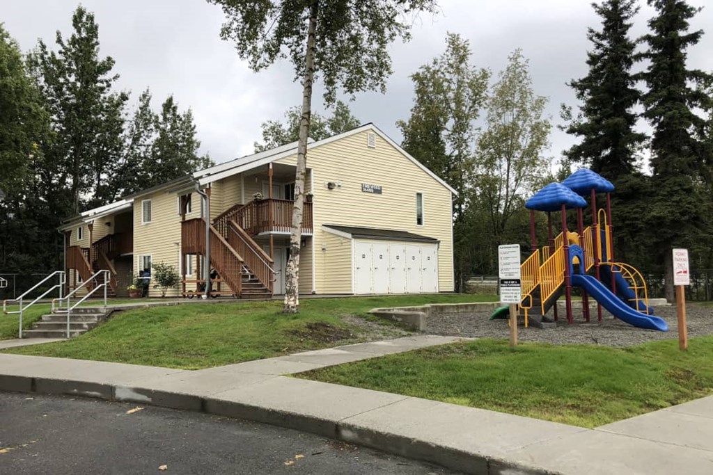 a playground in front of a house