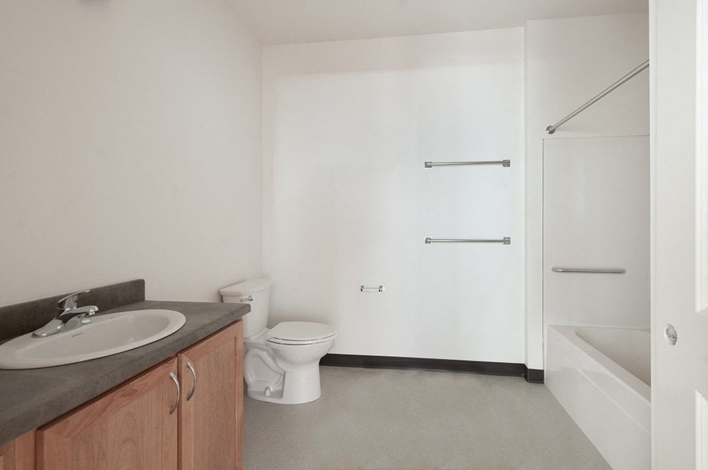 a bathroom with a sink toilet and a shower