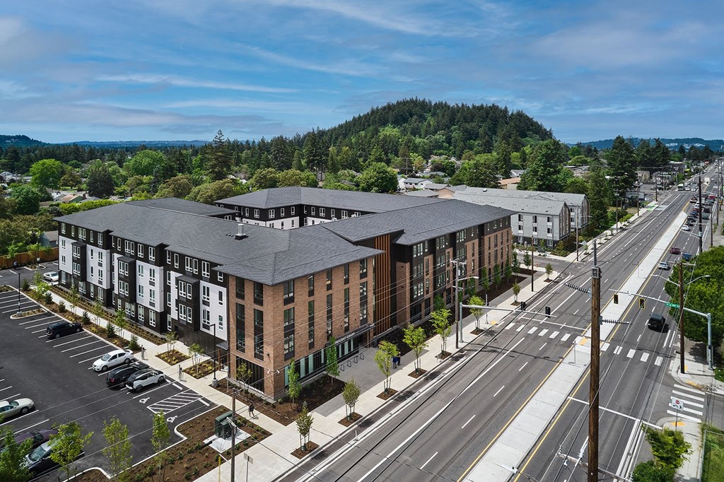 an aerial view of a building on a city street