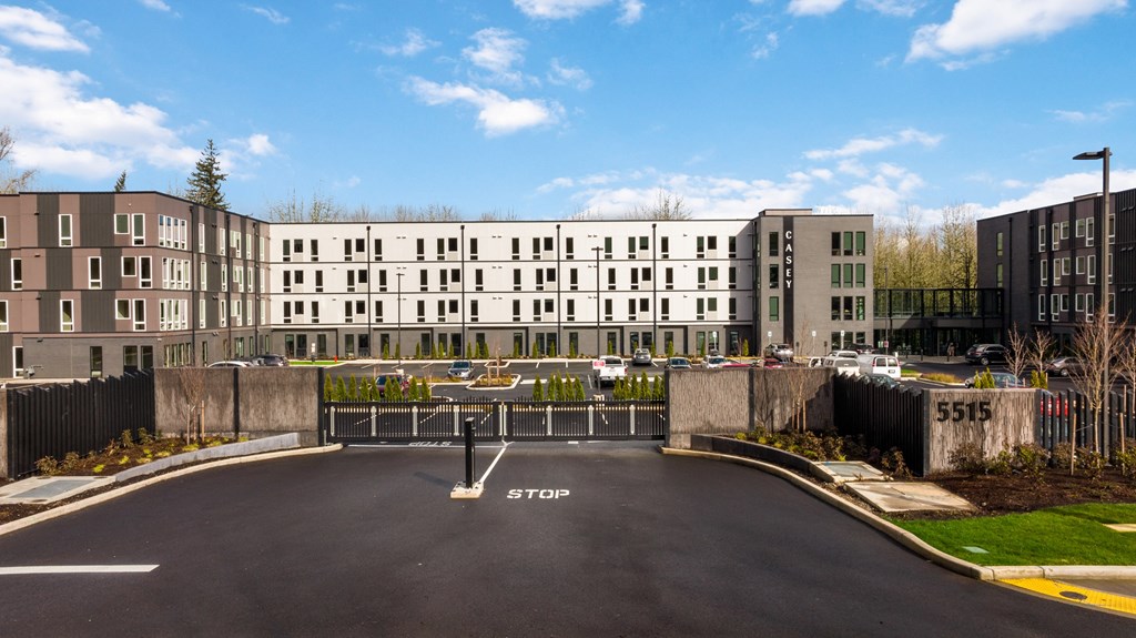 a parking lot in front of an apartment building