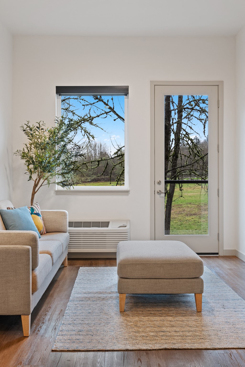 a living room with a couch and an and a window with a