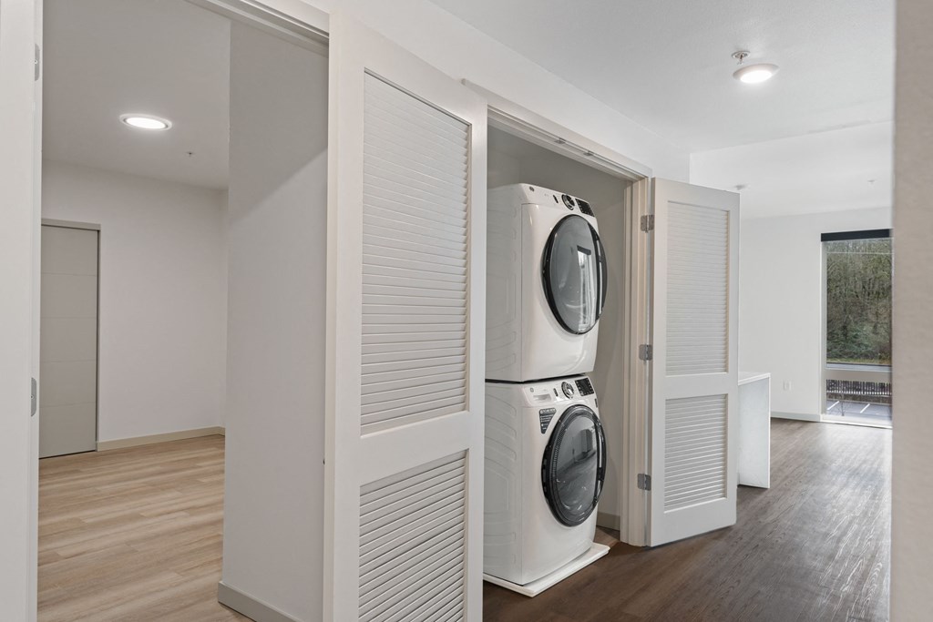 a laundry room with a washer and dryer in a closet