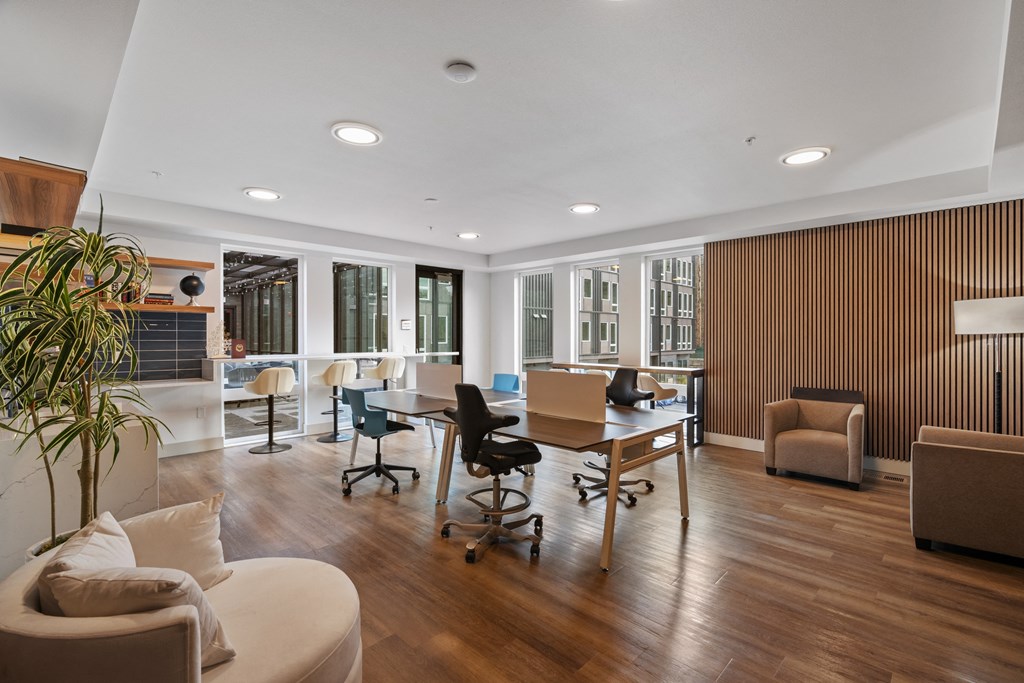 the living room has a large table with chairs and a couch