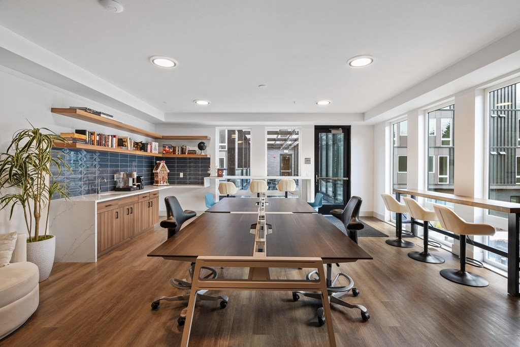 a conference room with a long wooden table and chairs