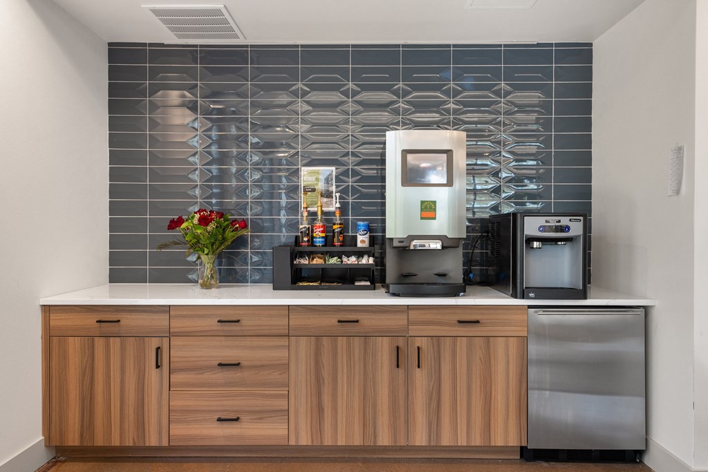 a kitchen with a counter top and a coffee machine