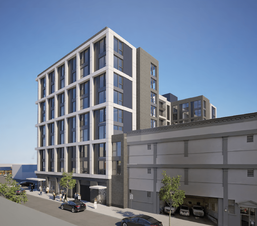 A modern building with a grey facade and large windows is depicted in the image.