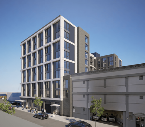 A modern building with a grey facade and large windows is depicted in the image.