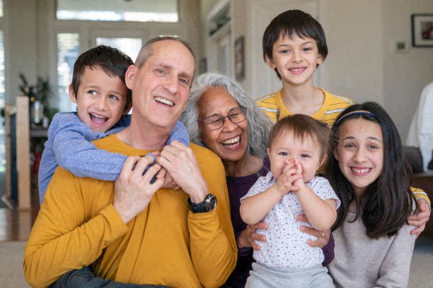 a family posing for a picture with their grandparents and grandchildren