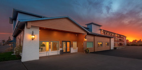 A building with a sunset in the background.