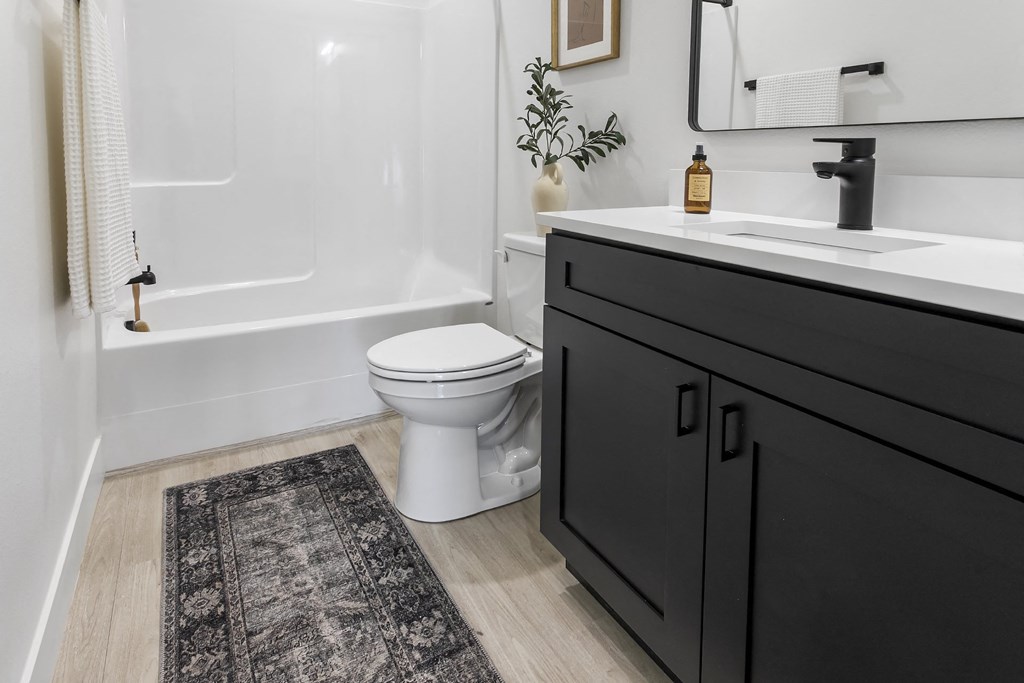 a bathroom with a toilet and a sink