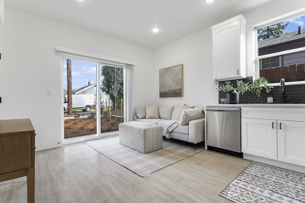 a living room with a couch and a sliding glass door