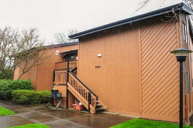 a wooden house with a wooden stairs