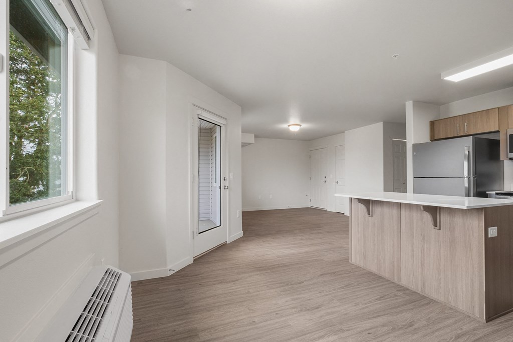 A kitchen area with a counter and cabinets.